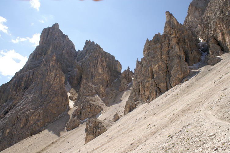 Across the scree slope towards the pass Across the scree slope towards the pass